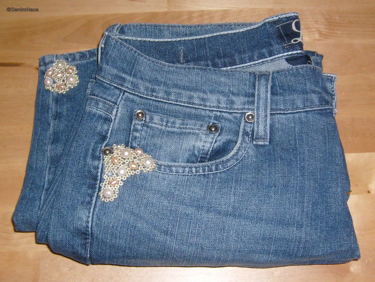 Embroidered floral hem denim jeans, close detail